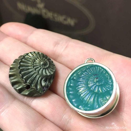 Sculpted Relief Resin Mold in an Open Bezel Sculpted Relief Resin Mold in an Open Bezel