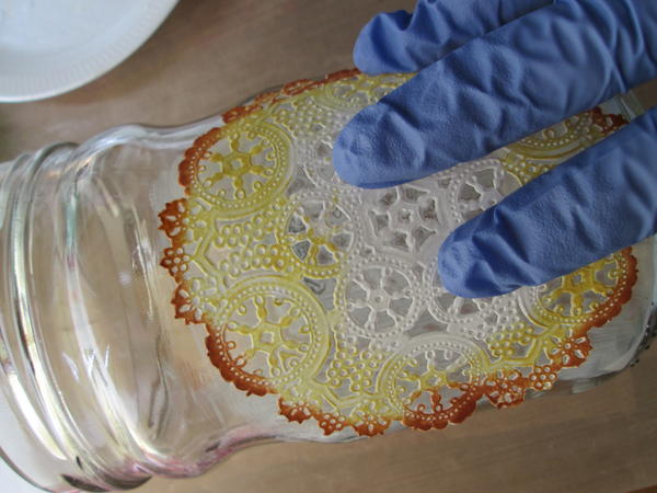 Carefully place the cutout onto the glass, beginning at one edge and gently pressing and rolling it smoothly onto the glass with your fingers. Carefully place the cutout onto the glass, beginning at one edge and gently pressing and rolling it smoothly onto the glass with your fingers.