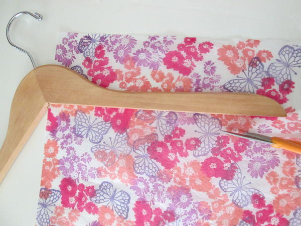 Position hanger on stamped tissue. Position hanger on stamped tissue.
