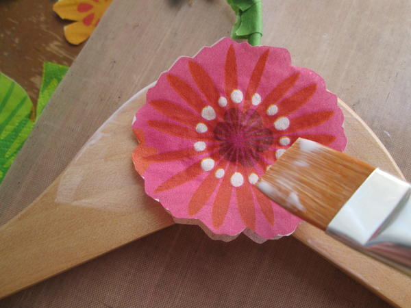 Gently brush additional medium over the flower to attach and smooth. Gently brush additional medium over the flower to attach and smooth.