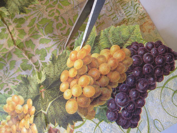 Cut grape and leaf images (or images of your choice) from the paper napkin, making sure to cut through both layers. Cut grape and leaf images (or images of your choice) from the paper napkin, making sure to cut through both layers.