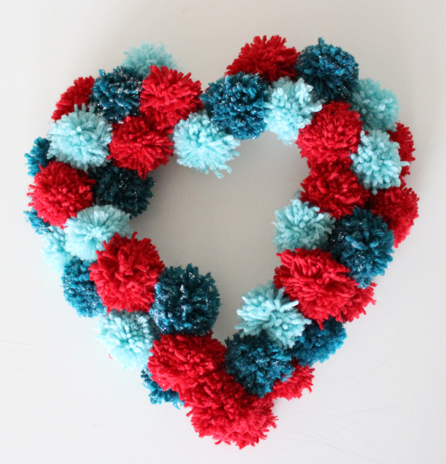 Good gift box ideas to sell #maravilladelregalo Valentine's Day Pom Pom Wreath | AllFreeHolidayCrafts.com