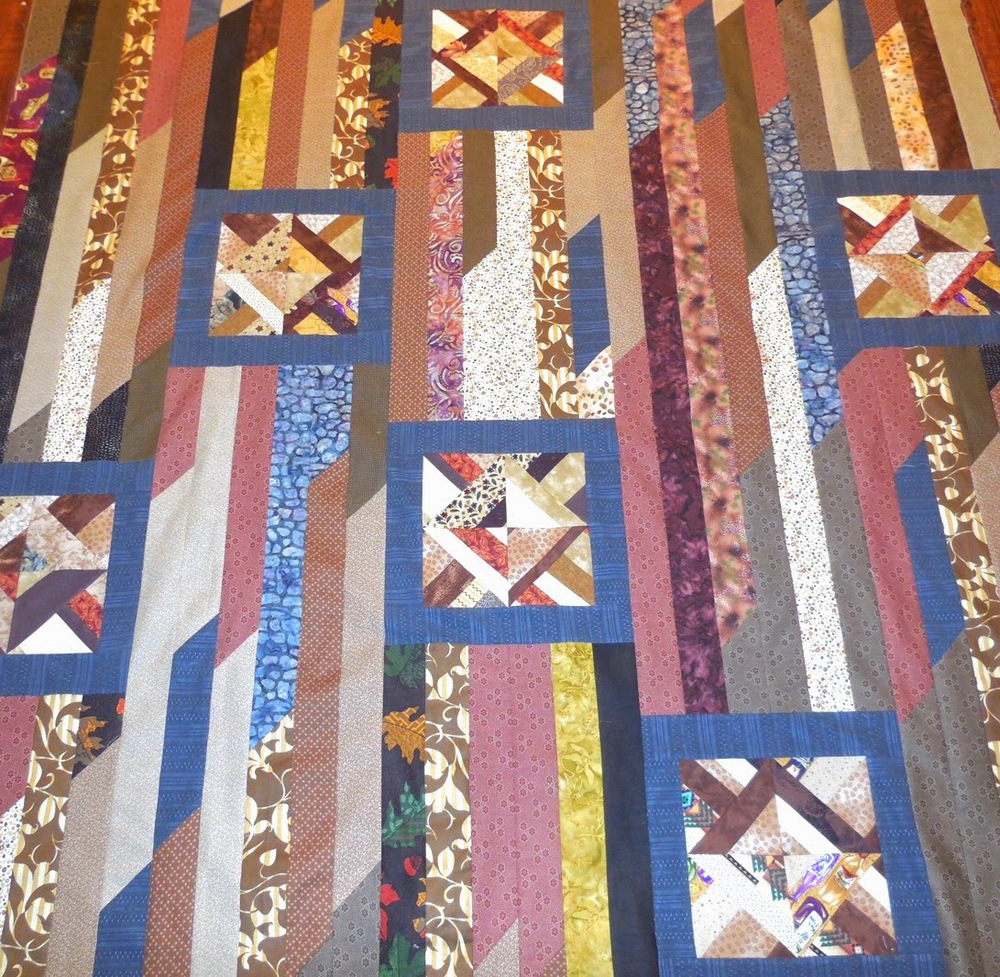 Odd Block Strip Quilt | FaveQuilts.com